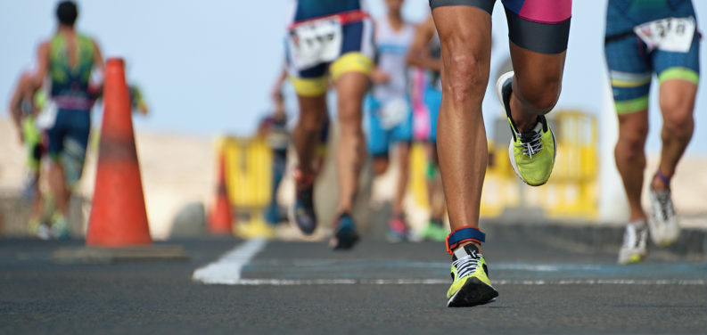 athletes running in ironman race
